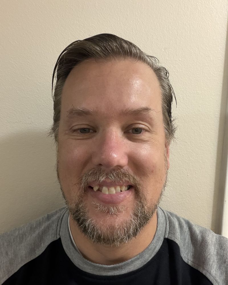 Portrait of writer Corey Widdison, smiling